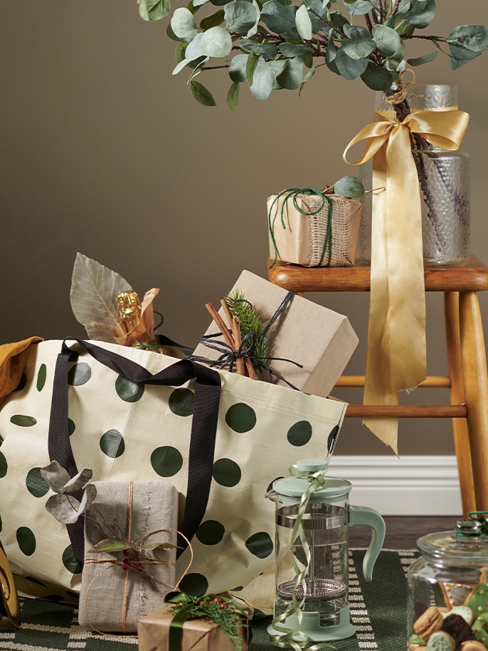 Polka dot bag with greenery.