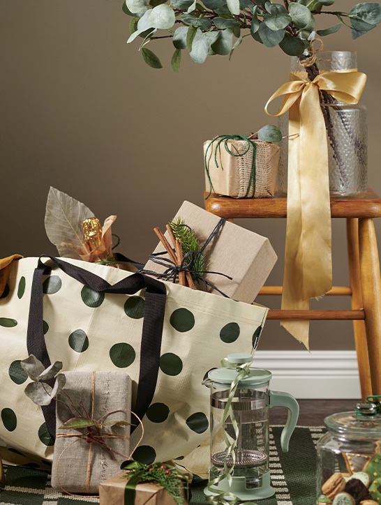 Polka dot bag with greenery.