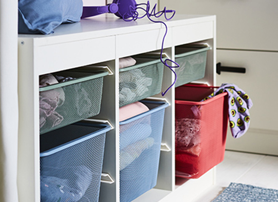 Mesh storage containers in bench.